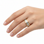 Gold Two Tone Meander Band Ring on woman's finger